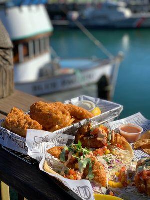 Fish tacos in front, fish and chips in back. On the patio overlooking the harbor.