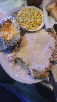 Chicken fried steak, baked potatoes and corn... mehhh