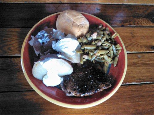 Here's another steak  special night special - cooked to order - with a baked potato and green beans.