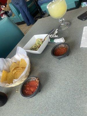 Chips, quac, salsa, and margarita