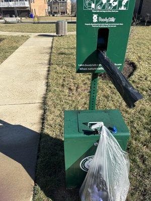 Dog waste station at the small pocket park for sitting and chatting