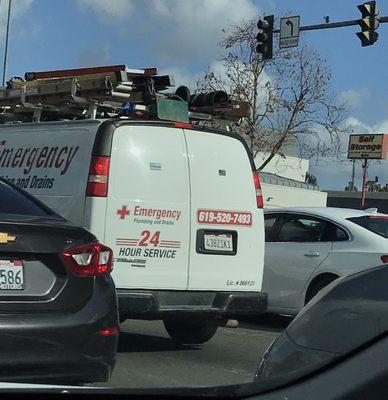 Aggressive driver's work truck stopped at the light.