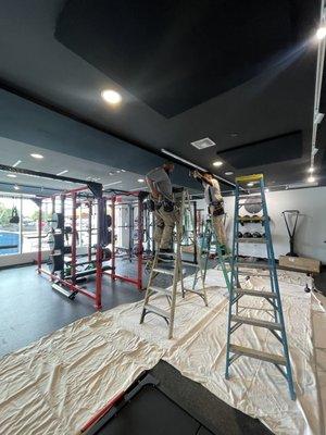 Mc=e3 Electric installing 30 foot LED strips for gym