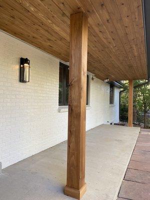 Front porch with the new cedar ceiling  and wrapped columns after