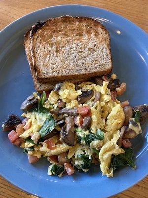 Egg Scramble with mushrooms, tomatoes, spinach plus wheat toast