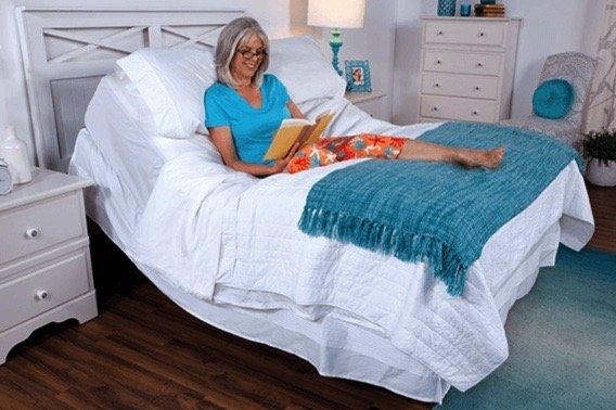 Laura enjoys reading in her adjustable mattress