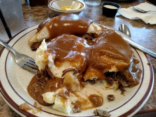 Classic.  Bread, beef potatoes, under gravy