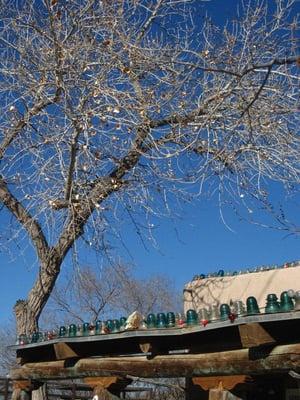 antique glass insulators line the roof like christmas ornaments