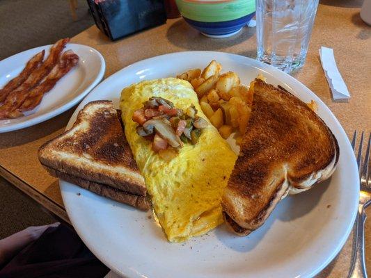 Veggie omelette, toast, home fries