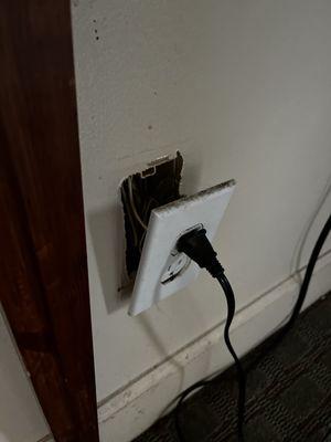 Another socket falling out of wall.