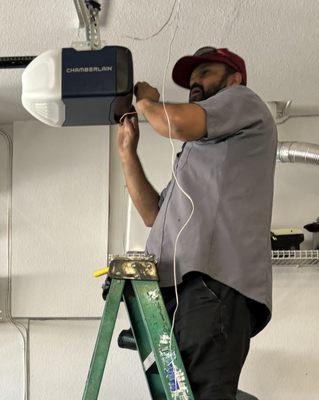 Javier Torres efficiently installing my  new garage door opener.