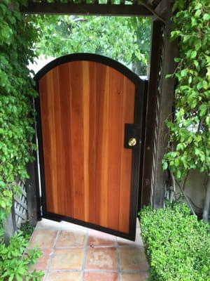 Gate separating our backyard to the pool area! Talk about modern!