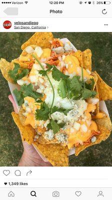 The Buffalo- cool ranch Doritos, corn tortilla chips, Franks Red buffalo chicken, sour cream, blue cheese, onion, and cilantro