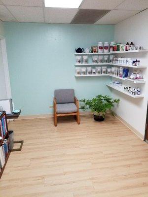 A view of the other side of Dr Smith's waiting room.  You can see all of his homemade teas on the shelf