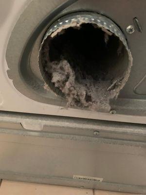 Dryer exhaust filled with lint. Professional dryer vent cleaning service.