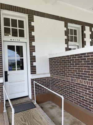 Segregated entrance to the original train station now used as a restroom (one is out of order)