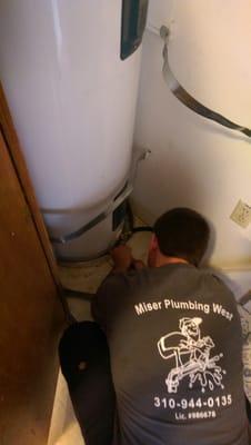 Here is my part time employee "nick" working on removing a 50gal. Elec. Water heater ($875.00).