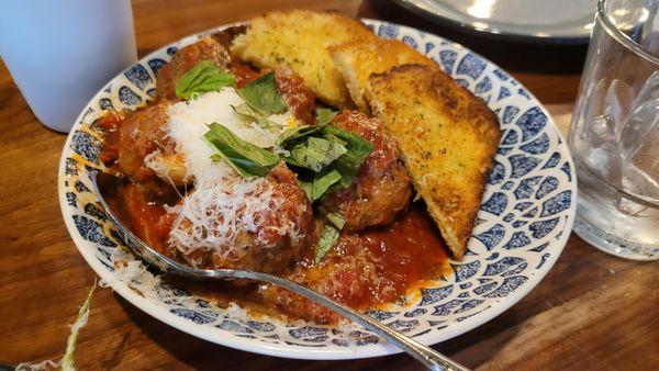 Roasted meatballs with ricotta, basil, polenta bread