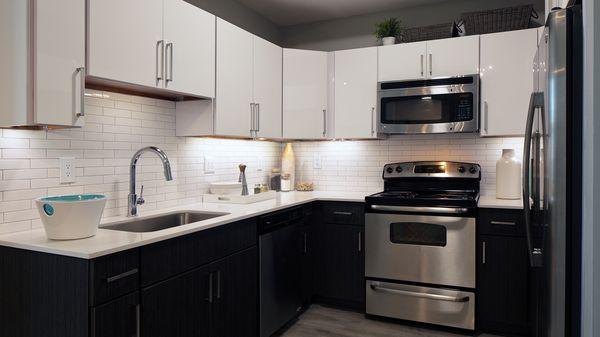 Upgraded fixtures and faucets, quartz counters and subway tile backsplashes