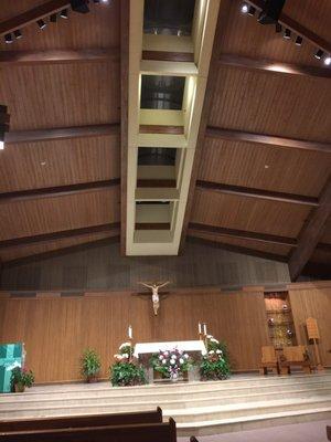 Vertical wood slat wall in front behind the alter