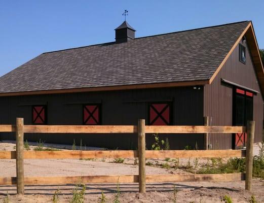 Three rail wood horse fence.