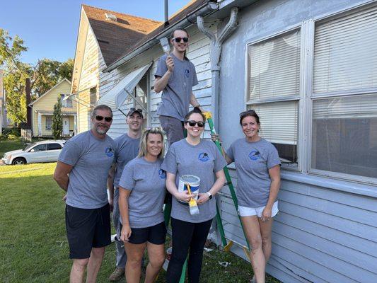 Ryan Harvey's Burlington State Farm team painting a home for a volunteer project