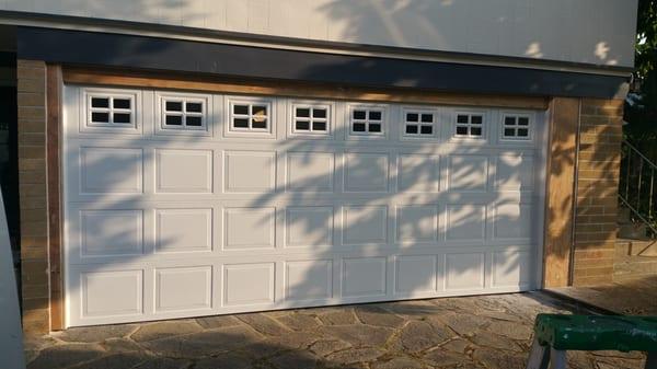 Framed in car port with new door and belt motor system call for a quote