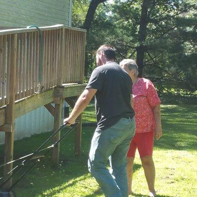 HRC's COO donating his time to a past client by fixing her mower and mowing the lawn