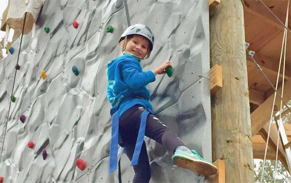 Girl Scout on the climbing wall at Camp Darden