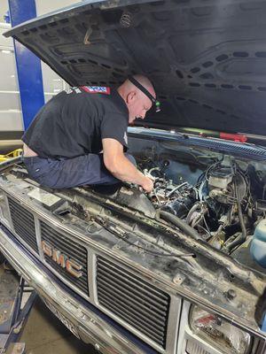 Peter working on an old classic Chevy