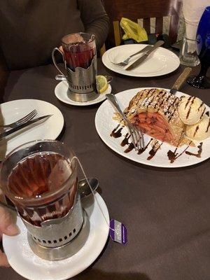 Apple strudel with ice cream and blackberry tea