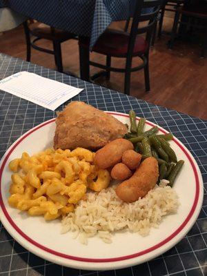 Rice, hush puppies, green beans, mac n cheese, fried chicken