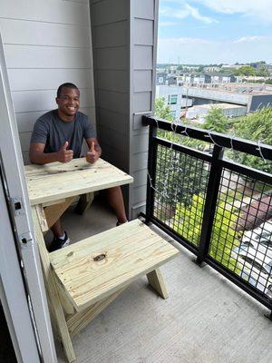 A satisfied client enjoying the half picnic table we built!