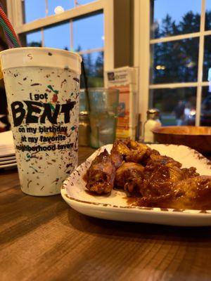 Stoner wings (mild buffalo mixed with bbq sauce) notice that blue Hawaiian drink in the background! Epic