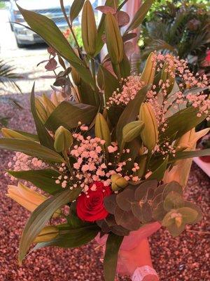 White blossom with a red rose