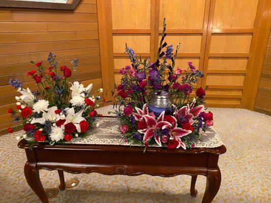 Floral arrangements for my son's and his fiancé's urns. Her urn wasn't placed on the left arrangement yet.