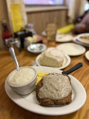 Chicken Fried Steak with grits, 2 scrambled eggs, and a light as air biscuit with a side of gravy...