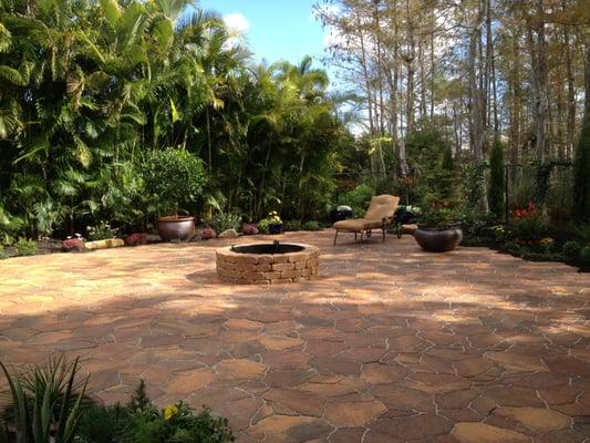 Large backyard fire pit entertaining area