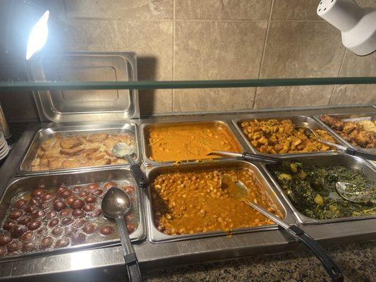 Chana Masala and other vegetables alongside dessert