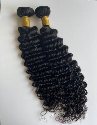 Human hair extensions on a weft. Shown are 20 inch and 22 inch.