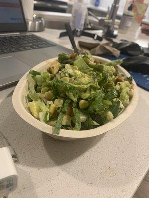 Burrito bowl with brown rice, white rice, beans, veggies, guacamole and sofritas.