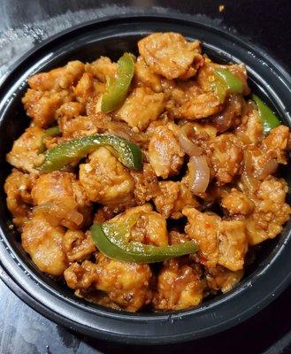 Haka Chili Chicken with less sauce. Tender chicken and peppers, in a slightly spicy sauce. Really delicious.