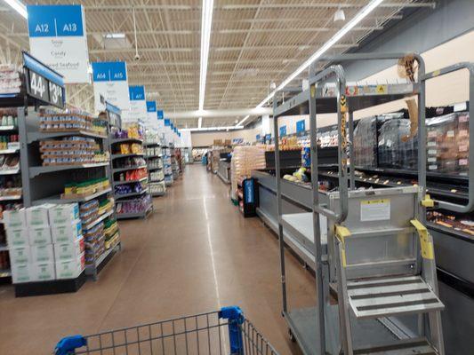 Grocery with a view of pallets in between all the coffins on the right