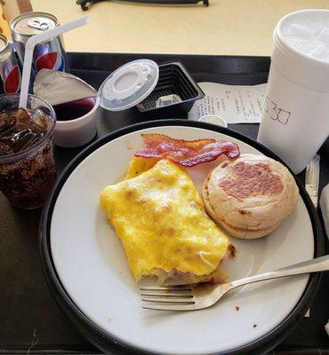 Yesterday's breakfast of ham and swiss omelet, bacon, English muffin with butter, and diet Pepsi.