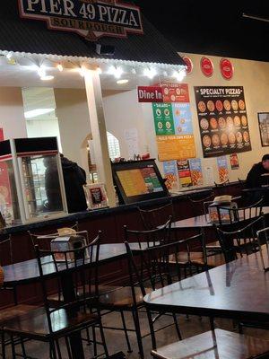 Employee sitting on counter.