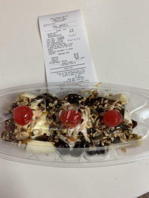 Ice cream, sundae, flavors, snickers, butter, pecan, and gold medal ribbon, topped with almonds and three cherries.