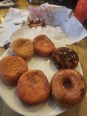 6 donuts jammed in a bag