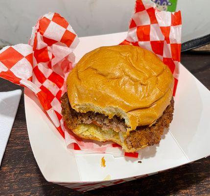 Burger with lettuce, tomato, and pickles