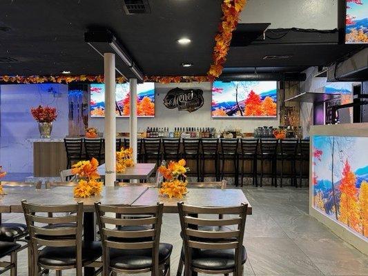 Colorful fall decorations and large bar area.