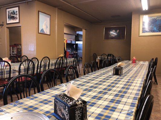 The back part of the pizza parlor, enough space for large groups or several couples and singles.